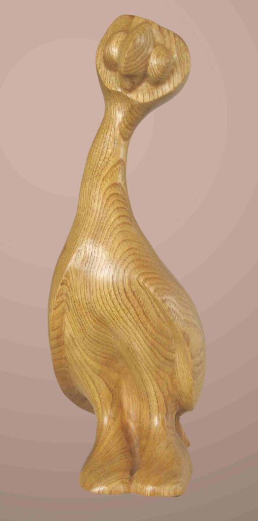 abstract stylized wood carving of a parrot family bird named iggy by gary carver of carverscarvings