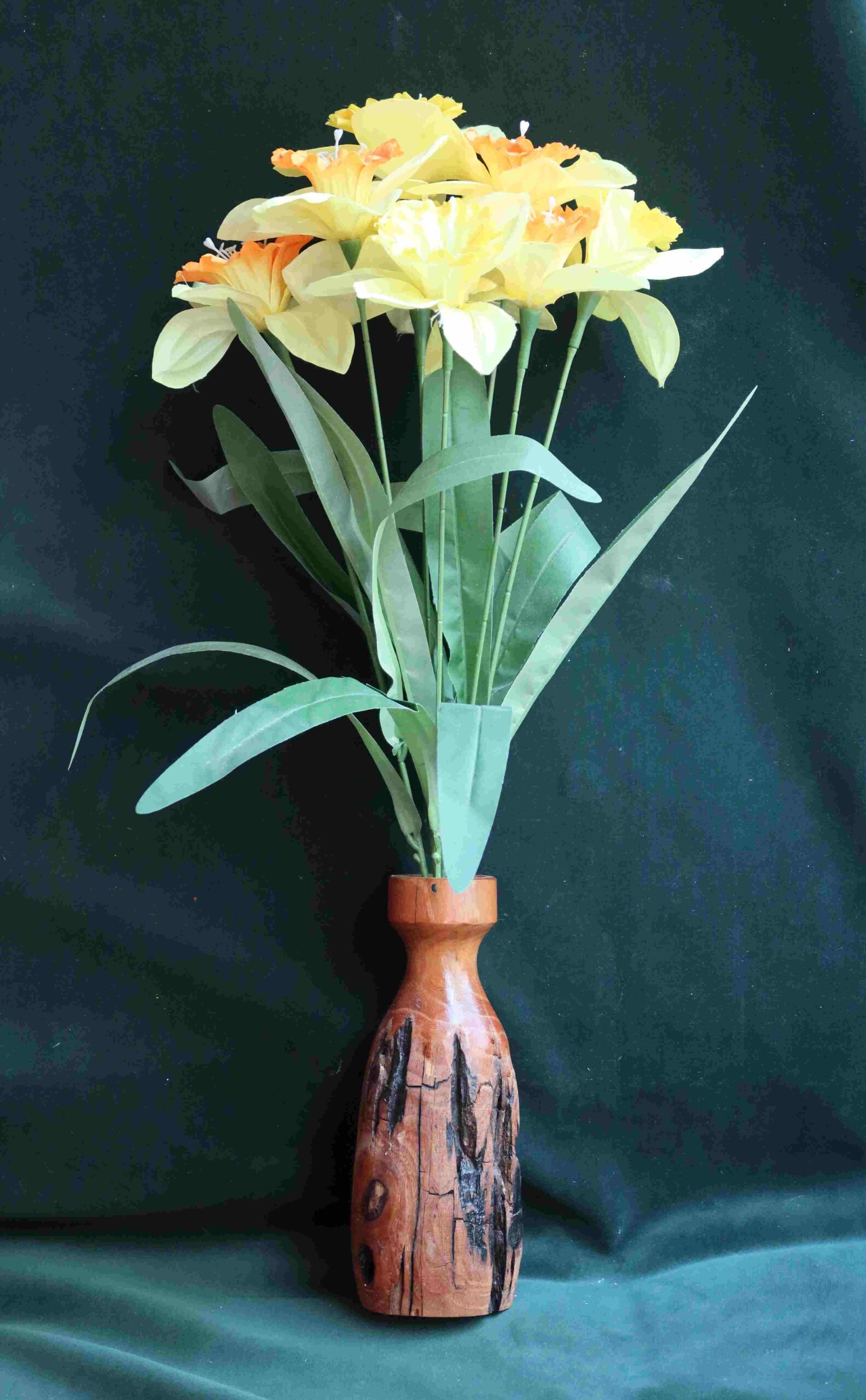 photograph of silk daffodils in a dry vase wood carving by gary carver of carverscarvings