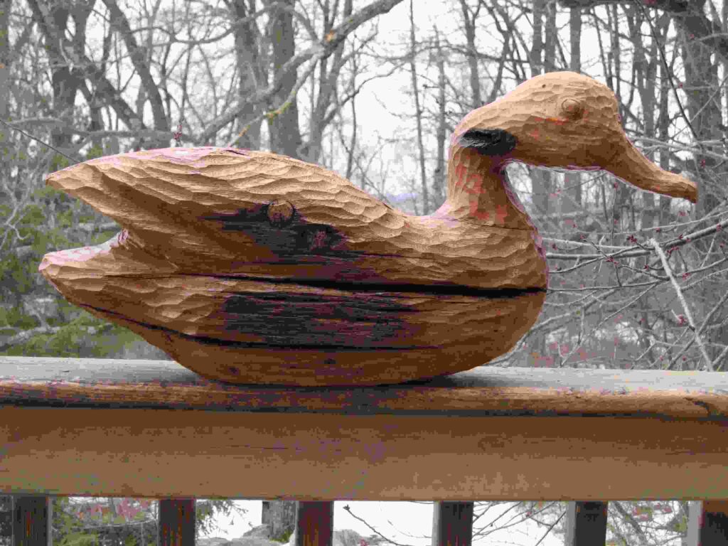 stylized oak wood beam carving of a duck by gary carver of carverscarvings