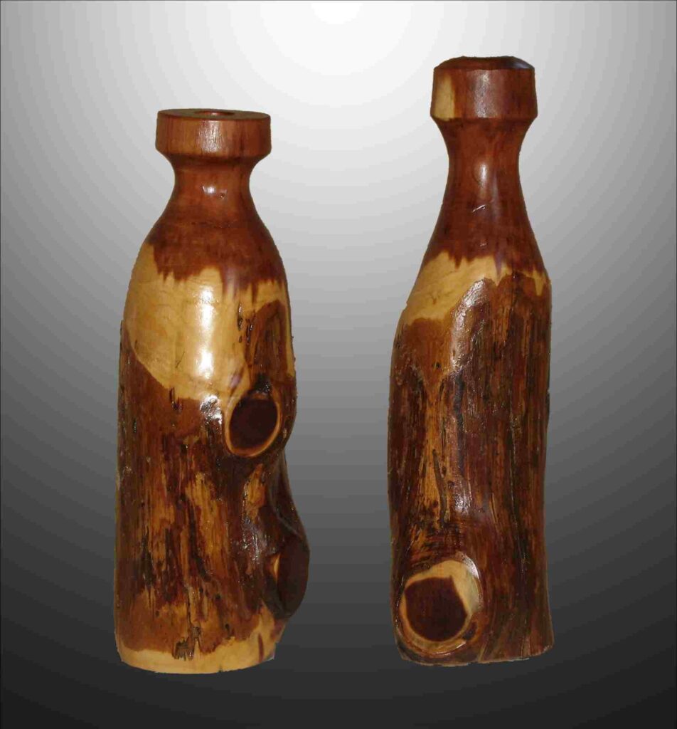 stylized wood carvings of two dry vases by gary carver of carverscarvings