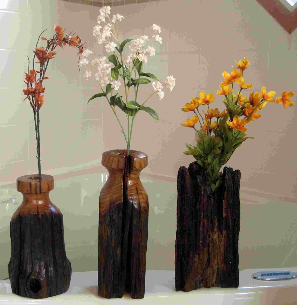 stylized wood carvings of three dry vases by gary carver of carverscarvings