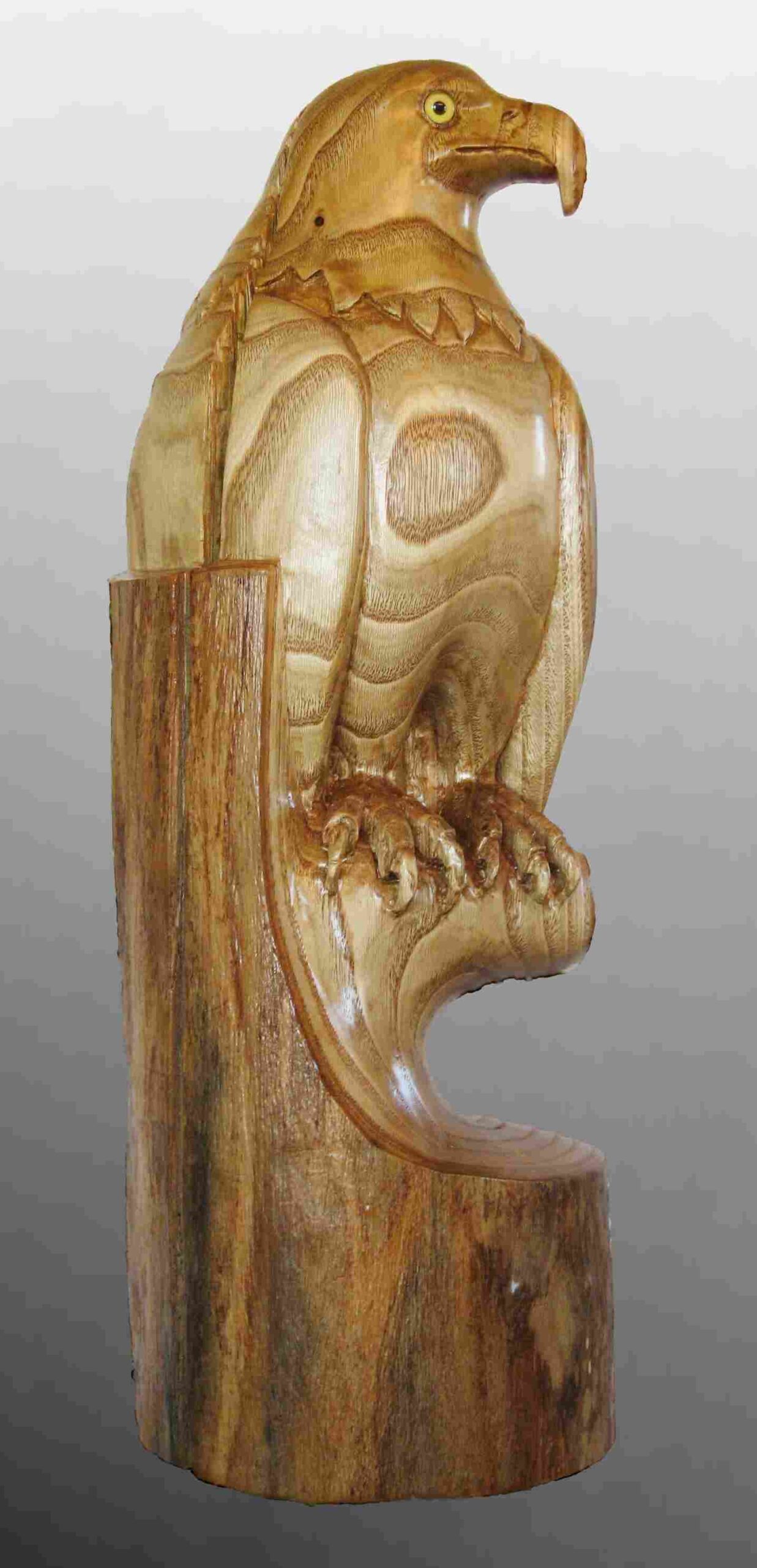 stylized wood carving of an eagle called integrity