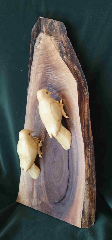 stylized downey woodpeckers wood carvings