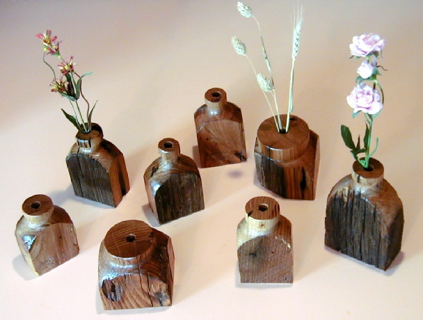 photograph of an assortment of small dry vases wood carvings by gary carver of carverscarvings