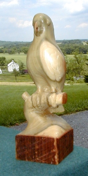 stylized poplar wood beam carving of a cockatoo by gary carver of carverscarvings